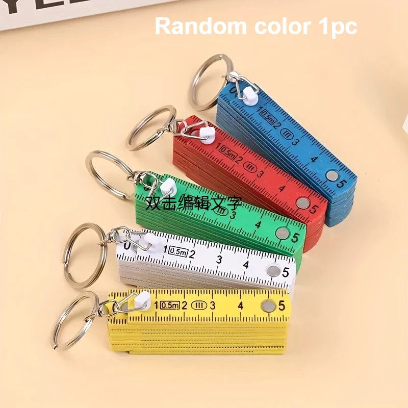 Mini Folding Ruler Keychain – Portable Plastic Measuring Tool Folding Keychain Ruler Qme Random color 1pc