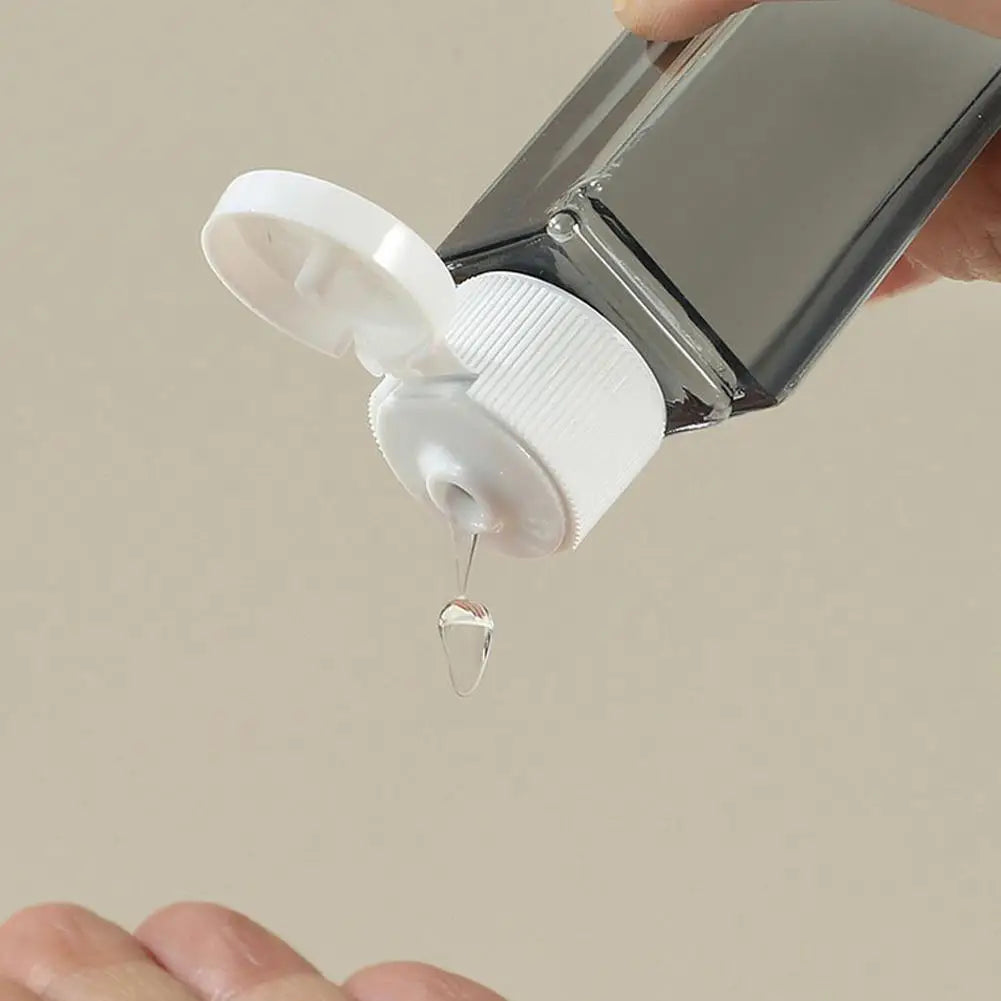 4-in-1 Refillable Travel Dispenser Bottles – Shampoo & Lotion Travel Dispenser Set Qme
